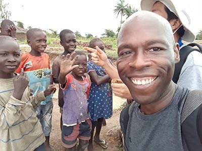 Frater Carl Gales SVD visits with children in the Democratic Republic of the Congo.